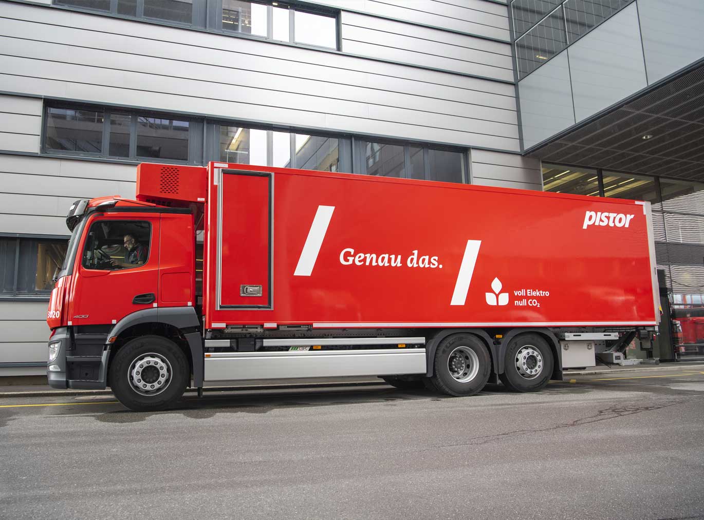 Red electric truck with the wordmark ‘Genau das.’ set in Tuna Italic and the Pistor logo